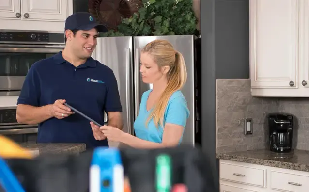 a water solutions expert assisting a home owner
