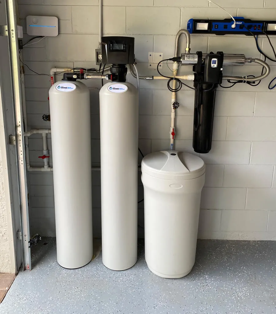 water filtration system setup within the garage of a home