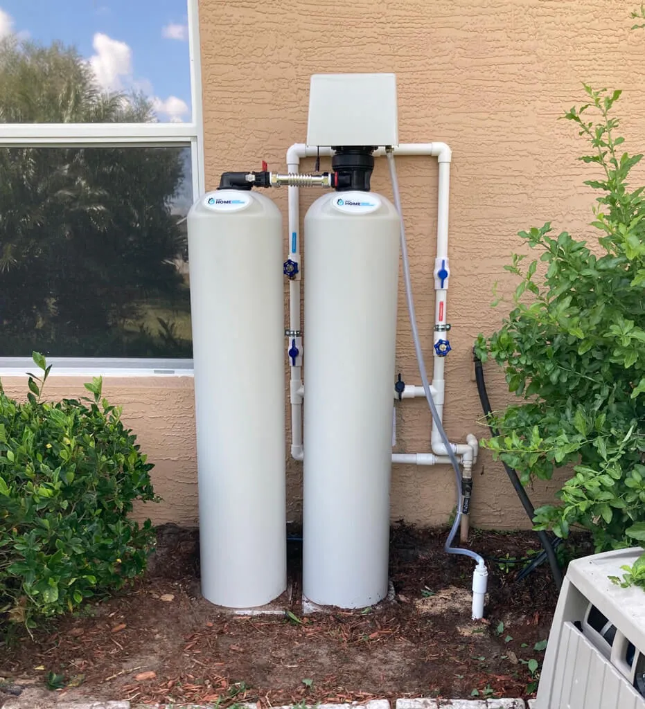 water filtration system setup on the outside of a home
