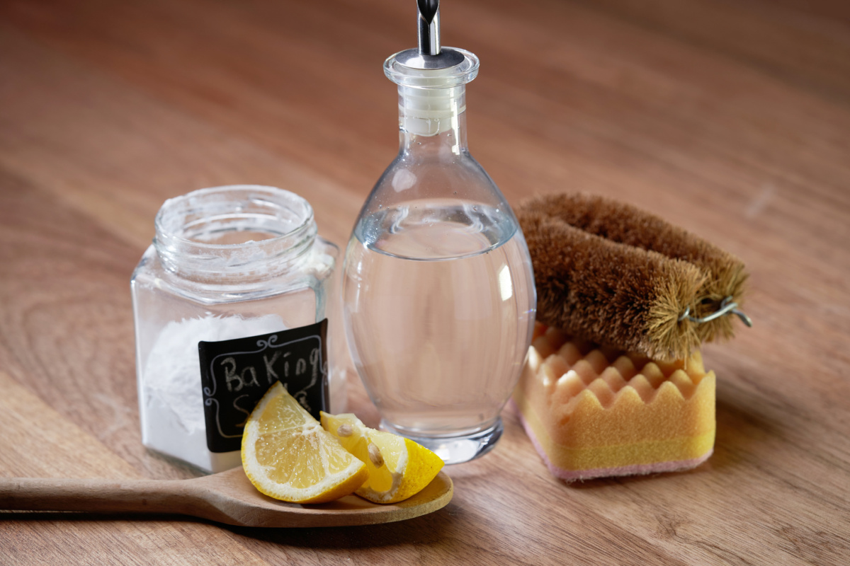 vinegar baking soda and lemon on wood table top to clean water stains