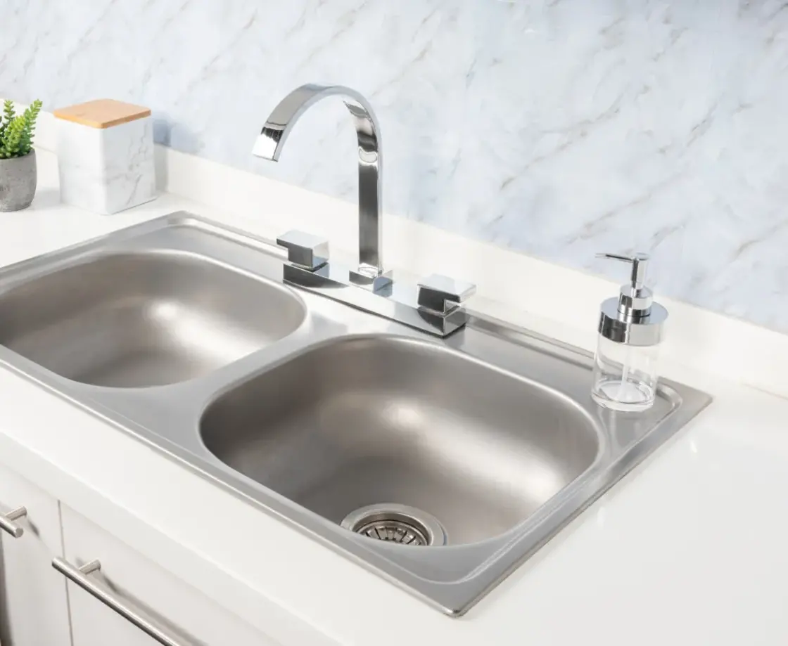Close-Up Double Basin Kitchen Sink and Faucet without water stains