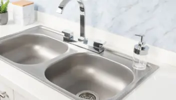 Close-Up Double Basin Kitchen Sink and Faucet without water stains