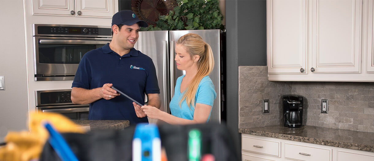 a water solutions expert assisting a home owner