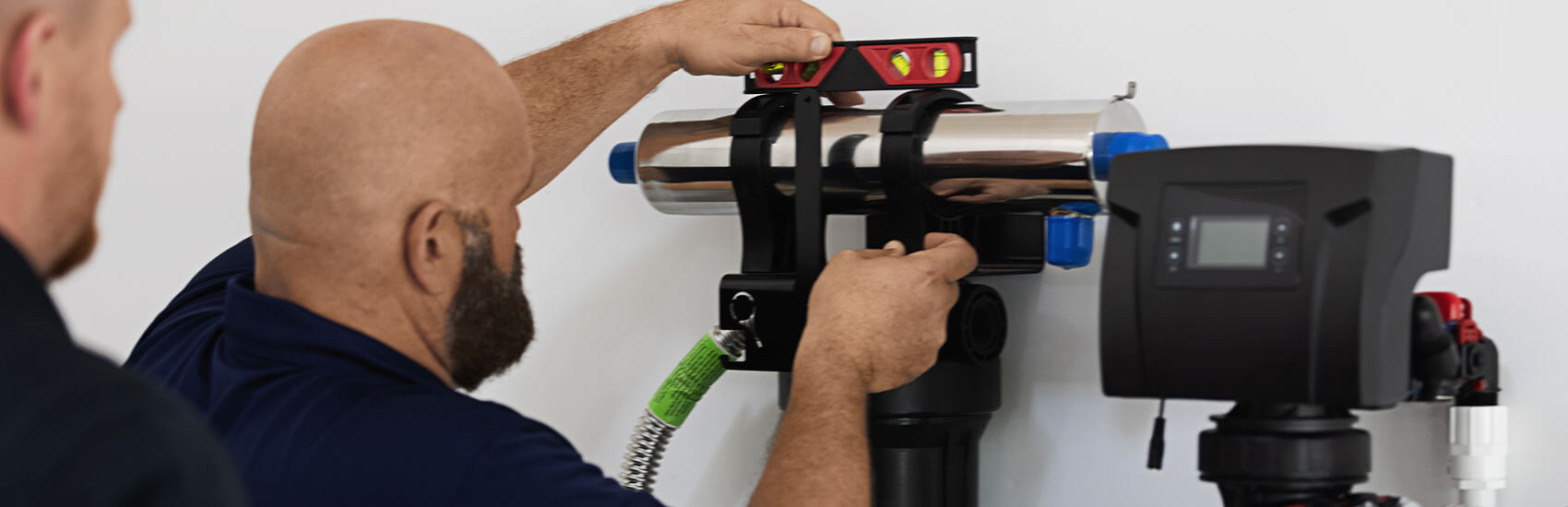 installation professional installing a water filtration system